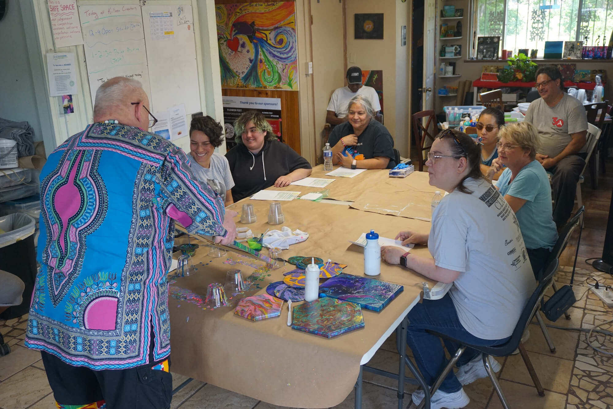Group working on arts and crafts around a table